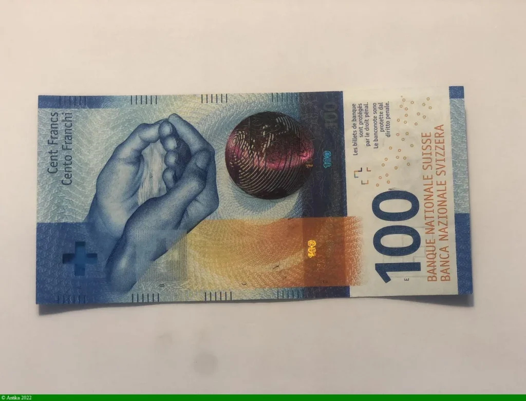 100 Francs Main & Globe