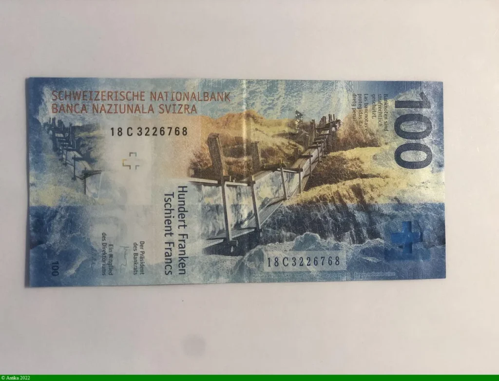 100 Francs Main & Globe