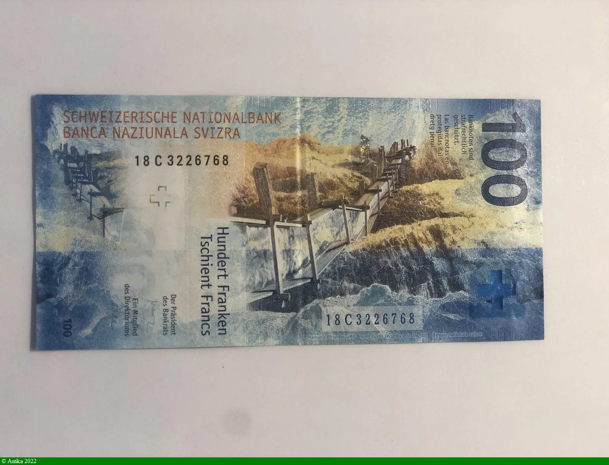 100 Francs Main & Globe