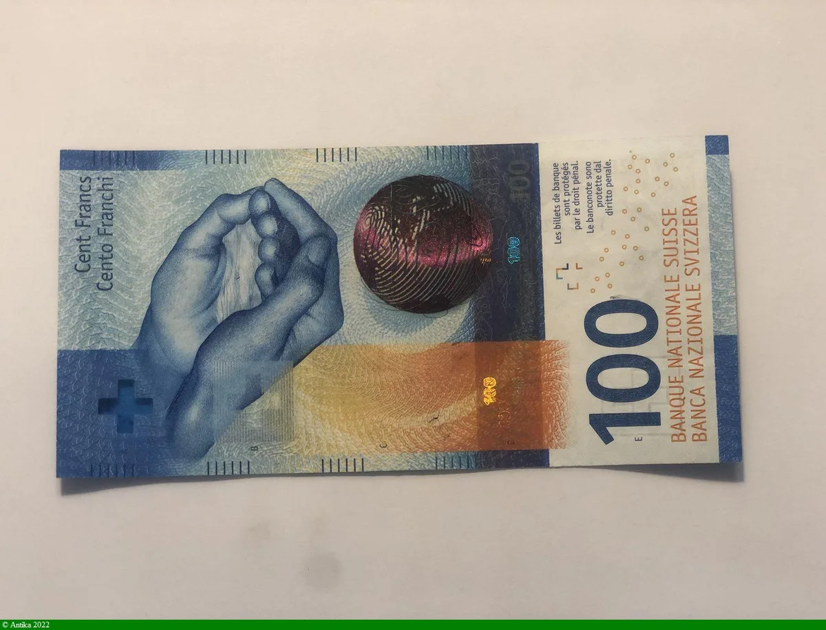 100 Francs Main & Globe